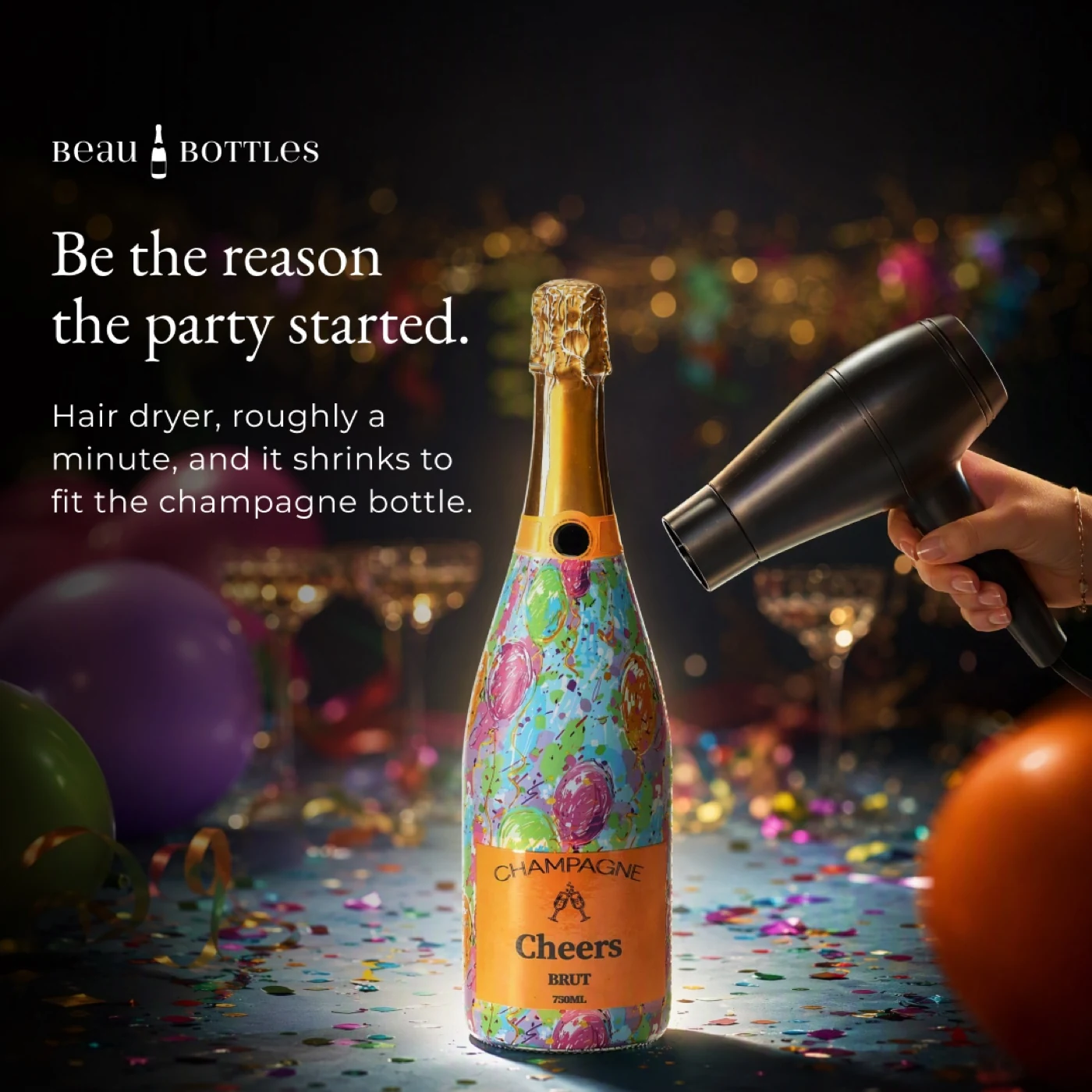 A hair dryer shrinking a colourful Beau Bottles wrap onto a champagne bottle