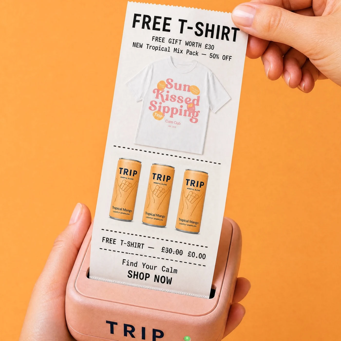 A hand holding a pink receipt printer above a TRIP product display
