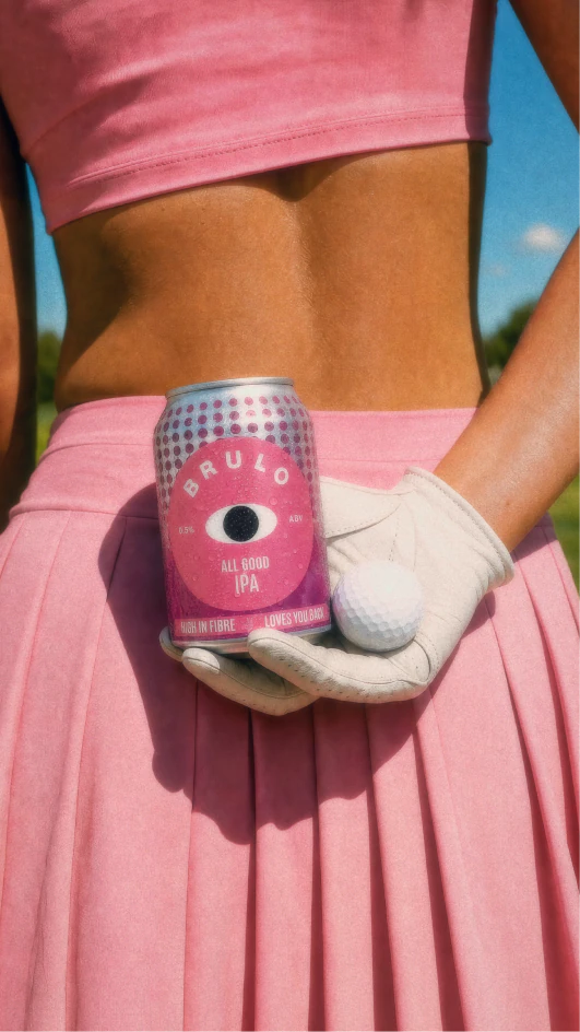 Person in pink holding a can and a ball in a bright BRULO creative.