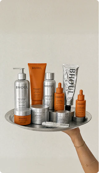Bhouli skincare and wellness products displayed on a silver tray.